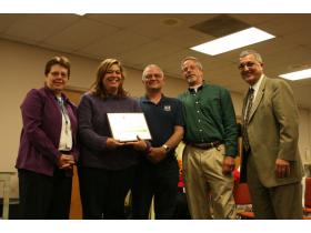Energy Education presented Lincoln with an environmental excellence award for environmental and financial resource stewardship. From left, Superintendent Lynn Cleary, School Board President Kimberly Samuelson, Jim Harless, Bob Grosshans and Michael Bitar.