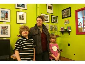 Michelle Shankwiler stands with her children Donald Tafini and Sharlene Shankwiler. Shankwiler 123, located at 35 E. Cross St. in Depot Town, will close its doors next Friday. 
