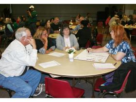 Ypsilanti Township resident Kathleen Hanadel takes notes as her and other residents attempt to asses WCSO services Tuesday evening at a community forum held at the township's community center.