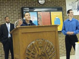 Sergio Espinoza addresses the audience at an honors assembly for Willow Run graduating seniors. Both Espinoza, middle, and Matt Reno, right, earned awards. Assistant Principal Shannon Smith, left, handed out the awards.