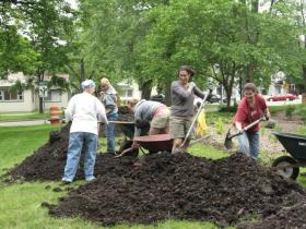 Residents and community members help the Luna Lake Native Plants Restoration Project in Prospect Park Saturday. A project to spread mulch in the park's playground is set for tomorrow.